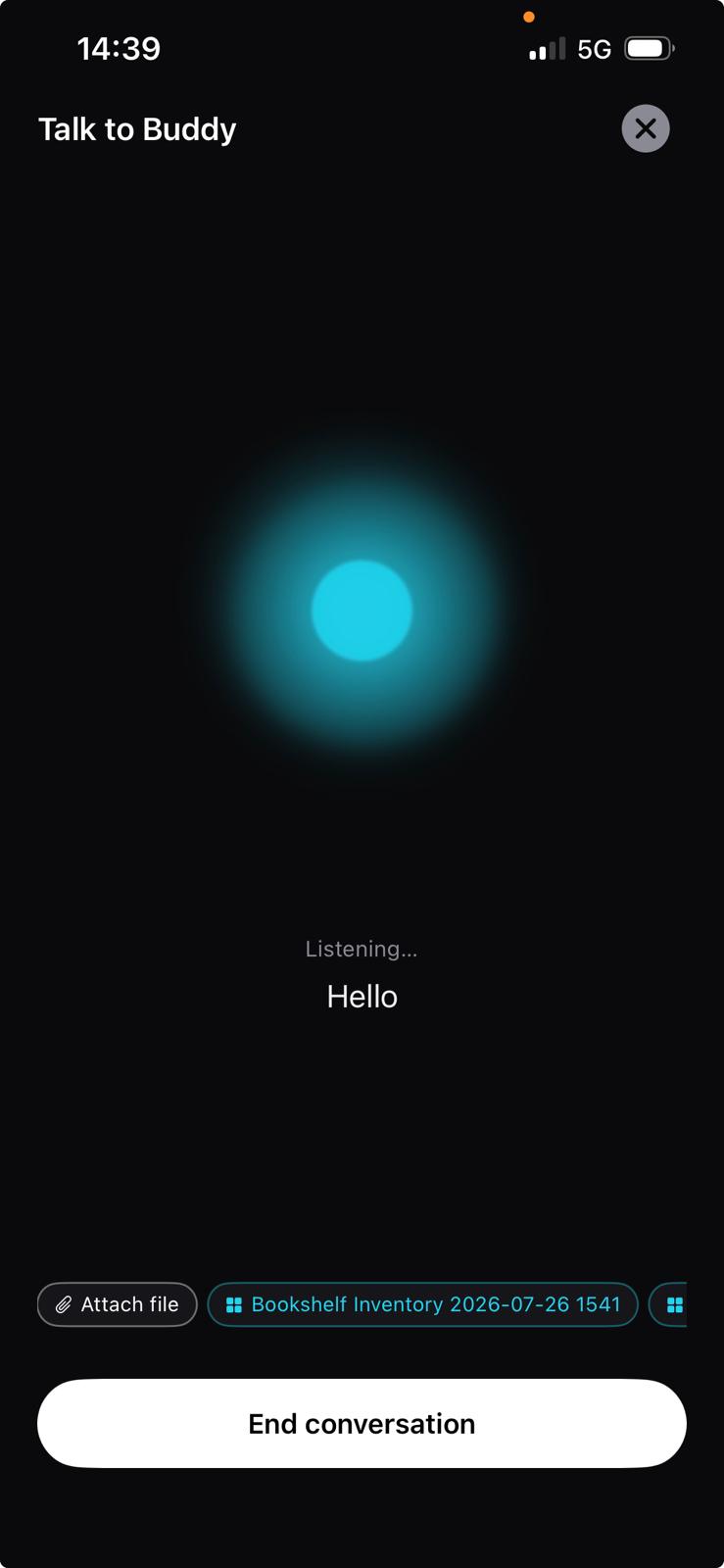 The voice chat screen in dark mode: a cyan orb, the label "Listening…" and the transcribed word "Hello", with attachment chips and an End conversation button.